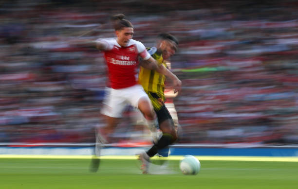 LONDON, ENGLAND - SEPTEMBER 29: Hector Bellerin of Arsenal is tackled during the Premier League match between Arsenal FC and Watford FC at Emirates Stadium on September 29, 2018 in London, United Kingdom. (Photo by Catherine Ivill/Getty Images)