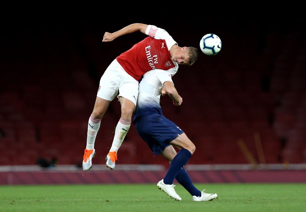 LONDON, ENGLAND - AUGUST 31: Daniel Ballard of Arsenal wins a header over Troy Parrott of Tottenham Hotspur during the Premier League 2 match between Arsenal and Tottenham Hotspur at Emirates Stadium on August 31, 2018 in London, England. (Photo by James Chance/Getty Images)