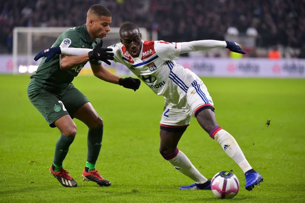 Lyon's French defender Ferland Mendy (R) vies with Saint-Etienne's French forward Kevin Monnet Paquet (L) during the French L1 football match between Lyon (OL) and Saint-Etienne (ASSE) on November 23, 2018, at the Groupama Stadium in Decines-Charpieu, near Lyon, central-eastern France. (Photo by ROMAIN LAFABREGUE / AFP / Getty Images)