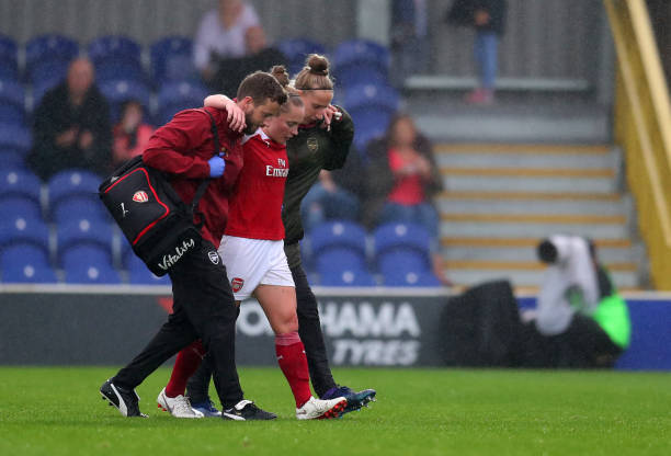 KINGSTON UPON THAMES, ENGLAND - OCTOBER 14: An injured Kim Little of Arsenal is taken off after being tackled by Drew Spence of Chelsea during the FA WSL match between Chelsea Women and Arsenal at The Cherry Red Records Stadium on October 14, 2018 in Kingston upon Thames, England. (Photo by Catherine Ivill/Getty Images)