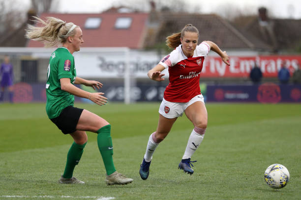 BOREHAMWOOD, ENGLAND - NOVEMBER 25: Lia Walti of Arsenal is challanged by Chloe Peplow of Brighton during the FA Super League match between Arsenal and Brighton and Hove Albion at Meadow Park on November 25, 2018 in Borehamwood, England. (Photo by Linnea Rheborg/Getty Images)