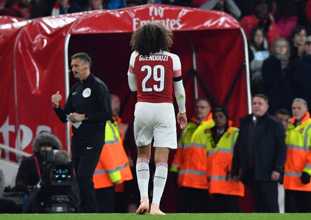 Arsenal's French midfielder Matteo Guendouzi leaves the pitch after being sent off for a second yellow card after a foul on Blackpool's English midfielder Jordan Thompson (unseen) during the English League Cup football match between West Ham United and Tottenham Hotspur at The London Stadium, in east London on October 31, 2018. (Photo by Ben STANSALL / AFP) / RESTRICTED TO EDITORIAL USE. No use with unauthorized audio, video, data, fixture lists, club/league logos or 'live' services. Online in-match use limited to 120 images. An additional 40 images may be used in extra time. No video emulation. Social media in-match use limited to 120 images. An additional 40 images may be used in extra time. No use in betting publications, games or single club/league/player publications. / (Photo credit should read BEN STANSALL/AFP/Getty Images)