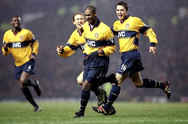 17 Feb 1999: Joy for Arsenal as Ray Parlour and Stephen Hughes rush to congratulate goalscorer Nicolas Anelka in the FA Carling Premiership match against Manchester United at Old Trafford in Manchester, England. The game ended 1-1. Mandatory Credit: Ben Radford /Allsport