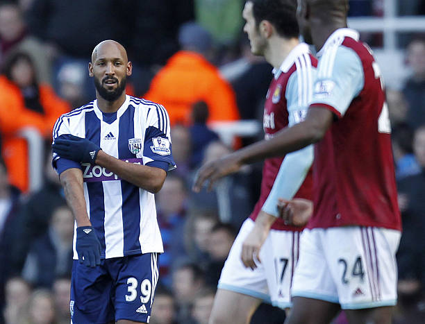 West Bromwich Albion's French striker Nicolas Anelka gestures as he celebrates scoring their second goal during the English Premier League football match between West Ham United and West Bromwich Albion at The Boleyn Ground, Upton Park in east London on December 28, 2013. The game finished 3-3. AFP PHOTO / IAN KINGTON RESTRICTED TO EDITORIAL USE. No use with unauthorized audio, video, data, fixture lists, club/league logos or live services. Online in-match use limited to 45 images, no video emulation. No use in betting, games or single club/league/player publications. (Photo credit should read IAN KINGTON/AFP/Getty Images)
