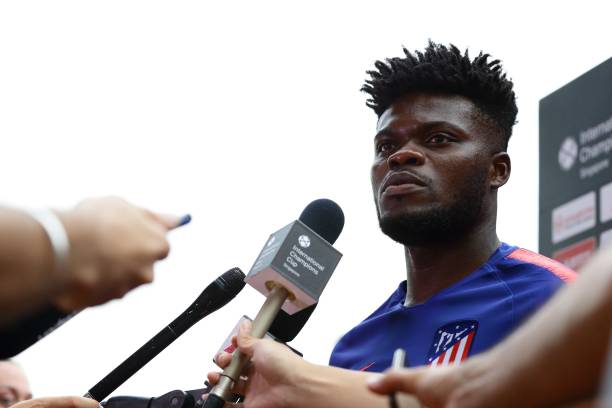 SINGAPORE - JULY 29: Thomas Partey of Atletico Madrid gives a pitch side interview during training ahead of the International Champions Cup match between Paris Saint Germain and Atletico Madrid at Bishan Stadium on July 29, 2018 in Singapore. (Photo by Suhaimi Abdullah/Getty Images for ICC)