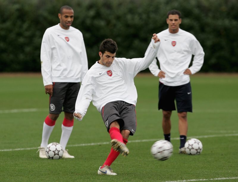 LONDON - OCTOBER 31: Cesc Fabregas shoots at goal watched by Thierry Henry (L) and Jeremie Aliadiere during the Arsenal training session at their London Colney training ground on October 31, 2006 in London Colney, England. (Photo by Christopher Lee/Getty Images)