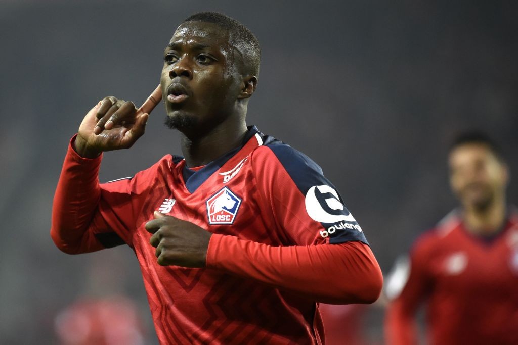 Lille's Ivorian forward Nicolas Pepe celebrates after scoring a goal during the French L1 football match between Lille (LOSC) and Olympique Lyonnais (OL) on December 1, 2018 at the Pierre Mauroy Stadium in Villenueve d'Ascq. (Photo by FRANCOIS LO PRESTI/AFP/Getty Images)