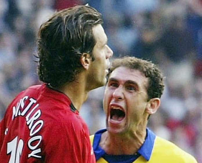 MANCHESTER, ENGLAND - SEPTEMBER 21: Martin Keown of Arsenal shows his feelings at Ruud Van Nistelrooy of Man Utd after Van Nistelrooy missed his penalty during the FA Barclaycard Premiership match between Manchester United and Arsenal at Old Trafford on September 21, 2003 in Manchester, England. (Photo by Shaun Botterill/Getty Images)