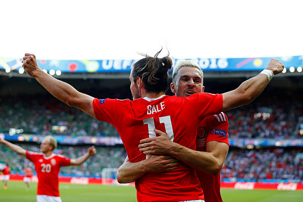 PARIS, FRANCE - JUNE 25:  Gareth Bale (L) and Aaron Ramsey (R) of Wales celebrate their team's first goal during the UEFA EURO 2016 round of 16 match between Wales and Northern Ireland at Parc des Princes on June 25, 2016 in Paris, France.  (Photo by Clive Rose/Getty Images)