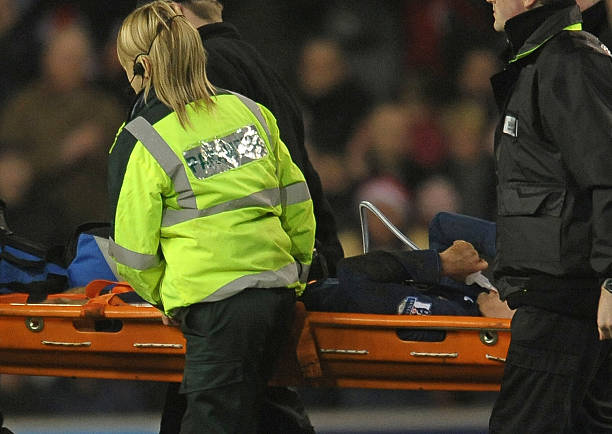 Arsenal's Welsh midfielder Aaron Ramsey is stretchered from the field during the English Premier League football match between Stoke City and Arsenal at the Britannia Stadium, Stoke-on-Trent, Staffordshire, central midlands, England on February 27, 2010. AFP PHOTO/Paul Ellis 