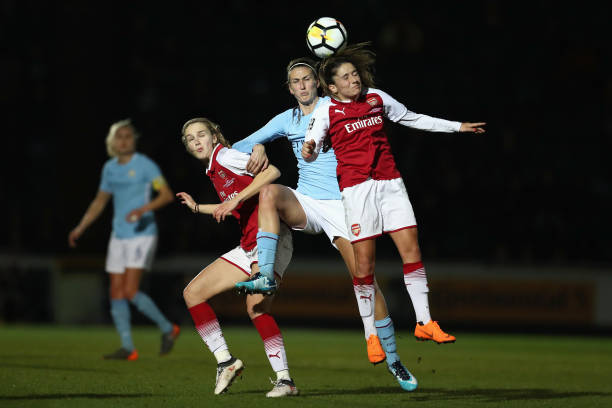 HIGH WYCOMBE, ENGLAND - MARCH 14: Jill Scott of Manchester City competes for a header with Danielle Van de Donk of Arsenal whilst also under pressure from Vivianne Miedema of Arsenal during the WSL Continental Cup Final between Arsenal Women and Manchester City Ladies at Adams Park on March 14, 2018 in High Wycombe, England. (Photo by Catherine Ivill/Getty Images)