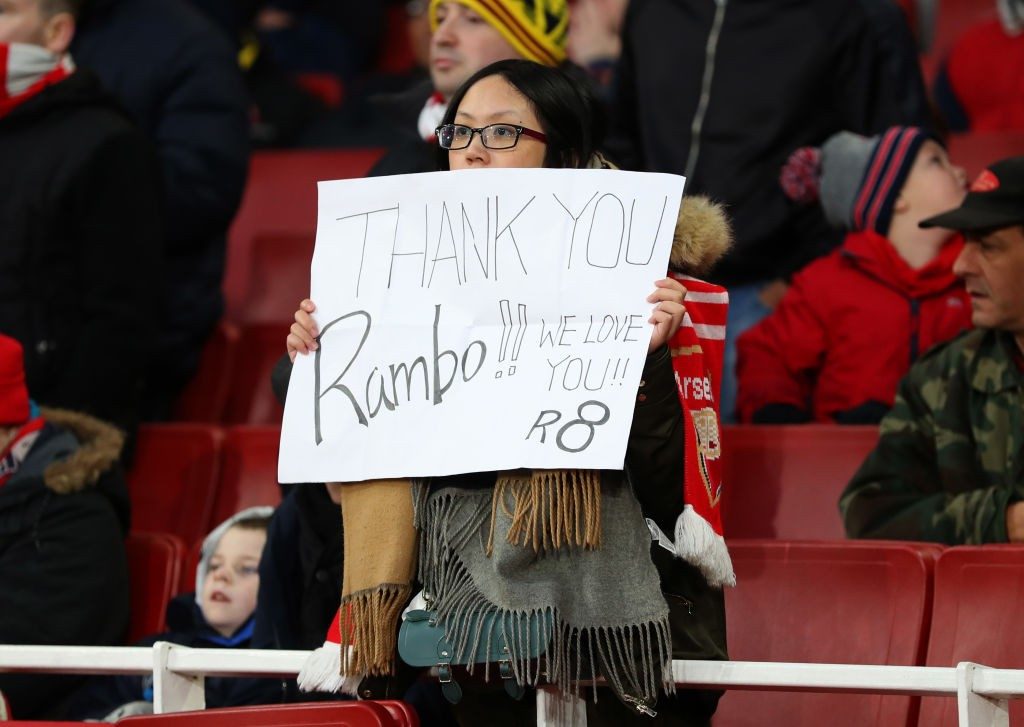 LONDON, ENGLAND - JANUARY 01: A fan holds up a sign thanking Aaron Ramsey of Arsenal during the Premier League match between Arsenal FC and Fulham FC at Emirates Stadium on January 1, 2019 in London, United Kingdom. (Photo by Catherine Ivill/Getty Images)