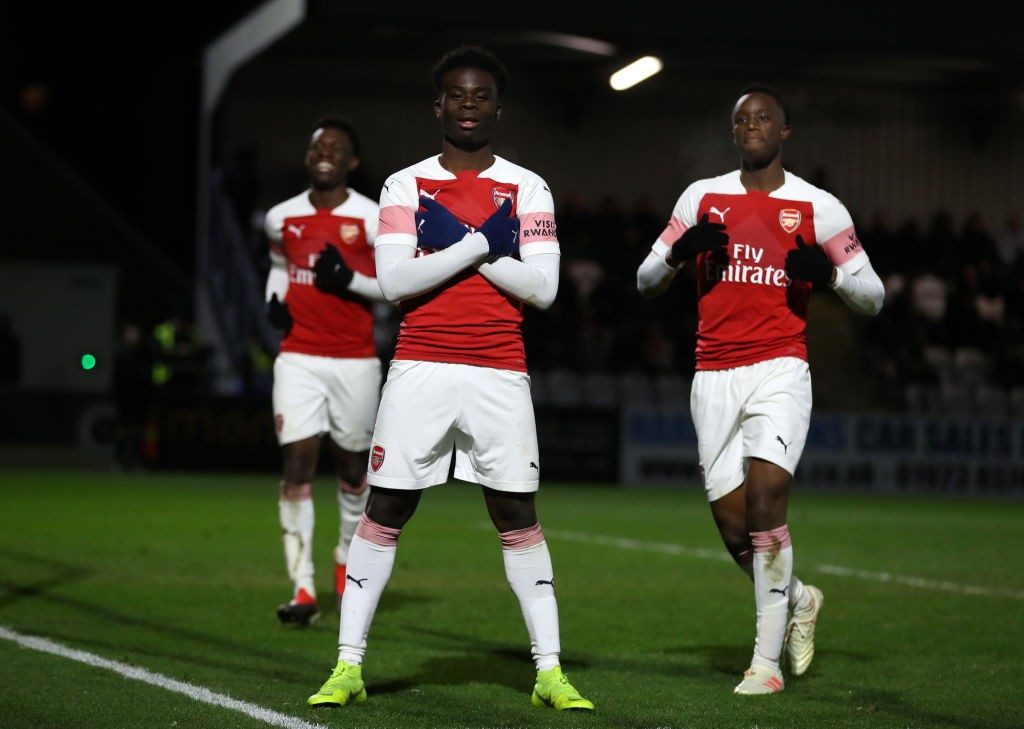 BOREHAMWOOD, ENGLAND - JANUARY 17: Bukayo Saka of Arsenal celebrates after he scores his sides fifth goal from the penalty spot with during the FA Youth Cup Fourth Round between Arsenal and Tottenham Hotspur at Meadow Park on January 17, 2019 in Borehamwood, England. (Photo by Catherine Ivill/Getty Images)