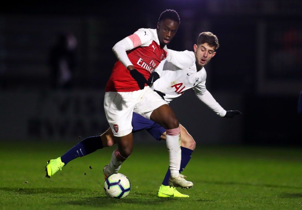 BOREHAMWOOD, ENGLAND - JANUARY 17: James Olayinka of Arsenal competes with Maurizio Pochettino of Tottenham Hotspur during the FA Youth Cup Fourth Round between Arsenal and Tottenham Hotspur at Meadow Park on January 17, 2019 in Borehamwood, England. (Photo by Catherine Ivill/Getty Images)
