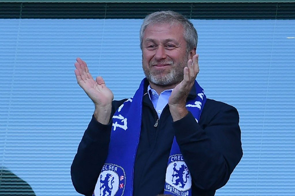 Chelsea's Russian owner Roman Abramovich applauds, as players celebrate their league title win at the end of the Premier League football match between Chelsea and Sunderland at Stamford Bridge in London on May 21, 2017. Chelsea's extended victory parade reached a climax with the trophy presentation on May 21, 2017 after being crowned Premier League champions with two games to go. / AFP PHOTO / Ben STANSALL / Getty Images