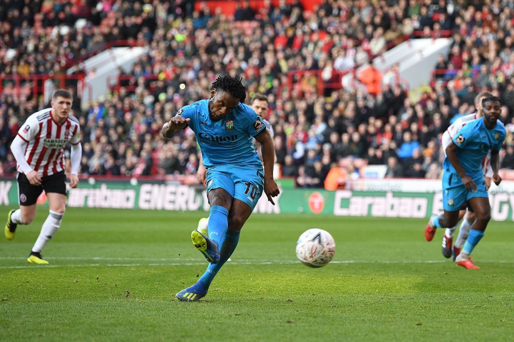 SHEFFIELD, ENGLAND - JANUARY 06: Shaquile Coulthirst of Barnet score the opening goal from a penalty during the FA Cup Third Round match between Sheffield United and Barnet at Bramall Lane on January 06, 2019 in Sheffield, United Kingdom. (Photo by Michael Regan/Getty Images)