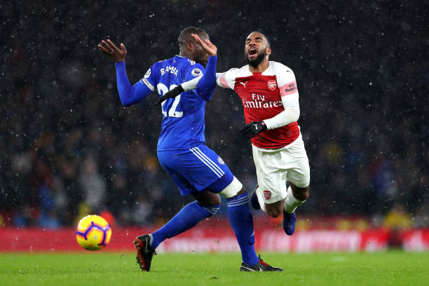 LONDON, ENGLAND - JANUARY 29:  Alexandre Lacazette of Arsenal is challenged by Sol Bamba of Cardiff City during the Premier League match between Arsenal and Cardiff City at Emirates Stadium on January 29, 2019 in London, United Kingdom.  (Photo by Catherine Ivill/Getty Images)