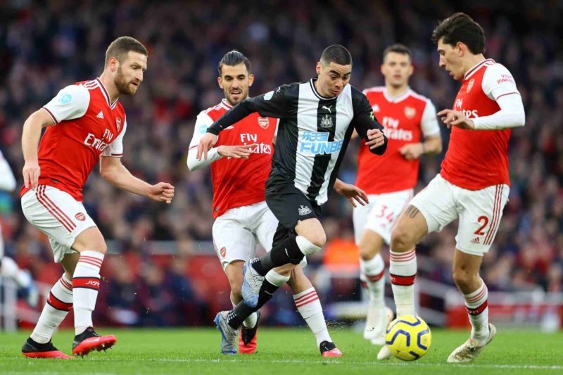 LONDON, ENGLAND - FEBRUARY 16: Miguel Almiron of Newcastle United takes on Hector Bellerin of Arsenal during the Premier League match between Arsenal FC and Newcastle United at Emirates Stadium on February 16, 2020 in London, United Kingdom. (Photo by Richard Heathcote/Getty Images)