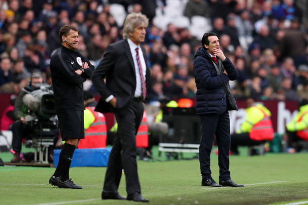 LONDON, ENGLAND - JANUARY 12:  Unai Emery, Manager of Arsenal (R) looks on during the Premier League match between West Ham United and Arsenal FC at London Stadium on January 12, 2019 in London, United Kingdom.  (Photo by Catherine Ivill/Getty Images)