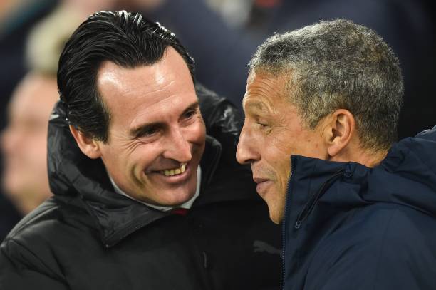 Arsenal's Spanish head coach Unai Emery (L) is greeted by Brighton's Irish manager Chris Hughton (R) for the English Premier League football match between Brighton and Hove Albion and Arsenal at the American Express Community Stadium in Brighton, southern England on December 26, 2018. (Photo by Glyn KIRK / AFP) 