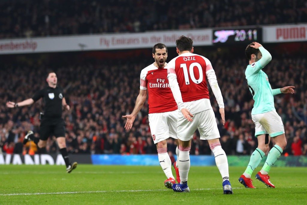 LONDON, ENGLAND - FEBRUARY 27: Henrikh Mkhitaryan of Arsenal celebrates after scoring his team's second goal with Mesut Ozil of Arsenal during the Premier League match between Arsenal FC and AFC Bournemouth at Emirates Stadium on February 27, 2019 in London, United Kingdom. (Photo by Catherine Ivill/Getty Images)