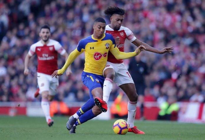 LONDON, ENGLAND - FEBRUARY 24: Alex Iwobi of Arsenal battles for possession with Yan Valery of Southampton during the Premier League match between Arsenal FC and Southampton FC at Emirates Stadium on February 23, 2019 in London, United Kingdom. (Photo by Richard Heathcote/Getty Images)