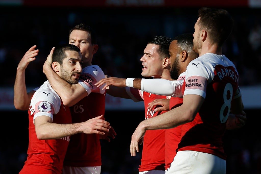 Arsenal's Armenian midfielder Henrikh Mkhitaryan (L) celebrates with Arsenal's Swiss defender Stephan Lichtsteiner after scoring their second goal during the English Premier League football match between Arsenal and Southampton at the Emirates Stadium in London on February 24, 2019. (Photo by Ian KINGTON / AFP / Getty Images)