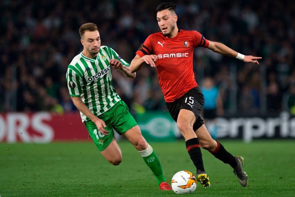 Real Betis' Spanish forward Lorenzo Moron (L) vies for the ball with Rennes' Algerian defender Ramy Bensebaini during the UEFA Europa League round of 32 second leg football match between Real Betis and Rennes at the Benito Villamarin stadium in Sevilla on February 21, 2019. (Photo by JORGE GUERRERO / AFP / Getty Images)