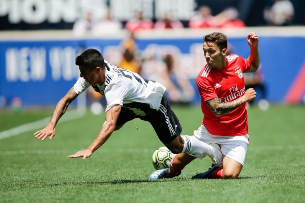 Joao Cancelo (L) of Juventus fights for the ball against Alejandro Grimaldo of Benfica during their 2018 International Champions Cup at the Red Bull Arena on July 28, 2018, in Harrison, New Jersey. (Photo by EDUARDO MUNOZ ALVAREZ / AFP / Getty Images)