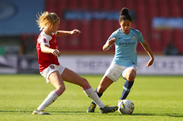SHEFFIELD, ENGLAND - FEBRUARY 23: Demi Stokes of Manchester City Women is challenged by Leah Williamson of Arsenal during the FA Women's Continental League Cup Final between Arsenal and Manchester City Women at Bramall Lane on February 23, 2019 in Sheffield, England.  (Photo by Catherine Ivill/Getty Images)