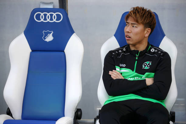 SINSHEIM, GERMANY - FEBRUARY 16: Takuma Asano of Hannover 96 looks on from the bench during the Bundesliga match between TSG 1899 Hoffenheim and Hannover 96 at PreZero-Arena on February 16, 2019 in Sinsheim, Germany. (Photo by Alex Grimm/Bongarts/Getty Images)
