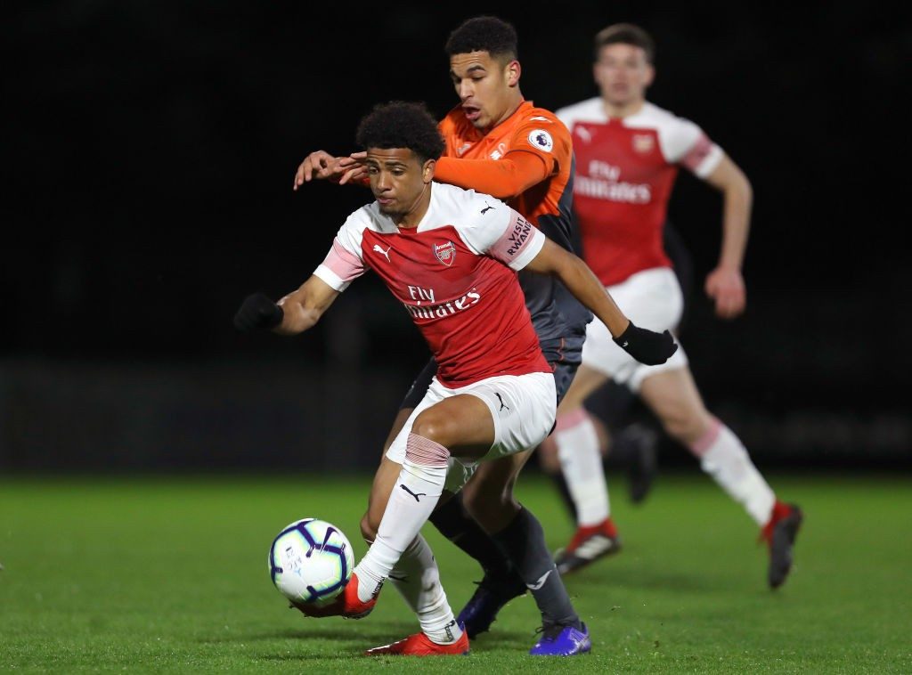 BOREHAMWOOD, ENGLAND - MARCH 04: Xavier Amaechi of Arsenal is challenged by Ben Cabango of Swansea City during the Premier League 2 match between Arsenal and Swansea City at Meadow Park on March 04, 2019 in Borehamwood, England. (Photo by James Chance/Getty Images)