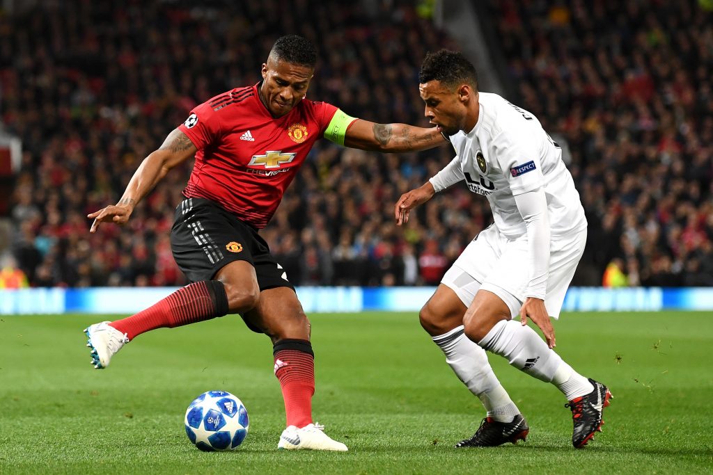MANCHESTER, ENGLAND - OCTOBER 02:  Antonio Valencia of Manchester United is challenged by Francis Coquelin of Valencia during the Group H match of the UEFA Champions League between Manchester United and Valencia at Old Trafford on October 2, 2018, in Manchester, United Kingdom.  (Photo by Michael Regan/Getty Images)