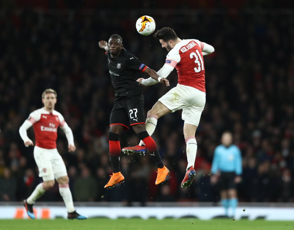 LONDON, ENGLAND - MARCH 14: Sead Kolasinac of Arsenal battles for possession in the air with Hamari Traore of Stade Rennais during the UEFA Europa League Round of 16 Second Leg match between Arsenal and Stade Rennais at Emirates Stadium on March 14, 2019, in London, England. (Photo by Bryn Lennon/Getty Images)