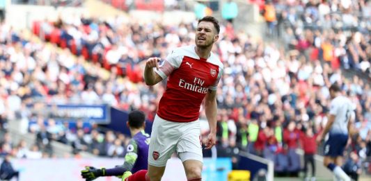LONDON, ENGLAND - MARCH 02: Aaron Ramsey of Arsenal celebrates after scoring his team's first goal during the Premier League match between Tottenham Hotspur and Arsenal FC at Wembley Stadium on March 02, 2019 in London, United Kingdom. (Photo by Clive Rose/Getty Images)