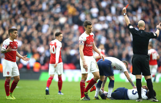 LONDON, ENGLAND - MARCH 02: Lucas Torreira of Arsenal is shown a red card by referee Anthony Taylor during the Premier League match between Tottenham Hotspur and Arsenal FC at Wembley Stadium on March 02, 2019 in London, United Kingdom. (Photo by Julian Finney/Getty Images)