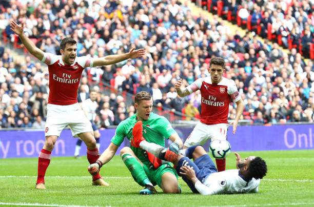 LONDON, ENGLAND - MARCH 02: Danny Rose of Tottenham Hotspur fouls Bernd Leno of Arsenal during the Premier League match between Tottenham Hotspur and Arsenal FC at Wembley Stadium on March 02, 2019 in London, United Kingdom. (Photo by Clive Rose/Getty Images)
