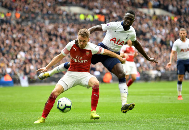 LONDON, ENGLAND - MARCH 02: Aaron Ramsey of Arsenal battles for possession with Davinson Sanchez of Tottenham Hotspur during the Premier League match between Tottenham Hotspur and Arsenal FC at Wembley Stadium on March 02, 2019 in London, United Kingdom. (Photo by Michael Regan/Getty Images)