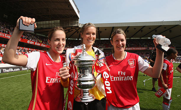 NOTTINGHAM, UNITED KINGDOM - MAY 05: Yvonne Tracy, Emma Byrne and Ciara Grant of Arsenal lead the trophy celebrations after victory in the The FA Womens Cup Sponsored by E.ON match between Arsenal and Leeds United at the City Ground on May 5, 2008 in Nottingham, England.  (Photo by Laurence Griffiths/Getty Images)