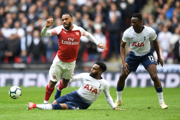 LONDON, ENGLAND - MARCH 02: Alexandre Lacazette of Arsenal is challenged by Danny Rose of Tottenham Hotspur during the Premier League match between Tottenham Hotspur and Arsenal FC at Wembley Stadium on March 02, 2019 in London, United Kingdom. (Photo by Michael Regan/Getty Images)