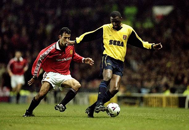 24 Jan 2000:  Patrick Vieira of Arsenal shields the ball from Ryan Giggs of Manchester United during the FA Carling Premier League match against Manchester United Arsenal played at Old Trafford in Manchester, England. The game finished in a 1-1 draw.  Credit: Alex Livesey /Allsport