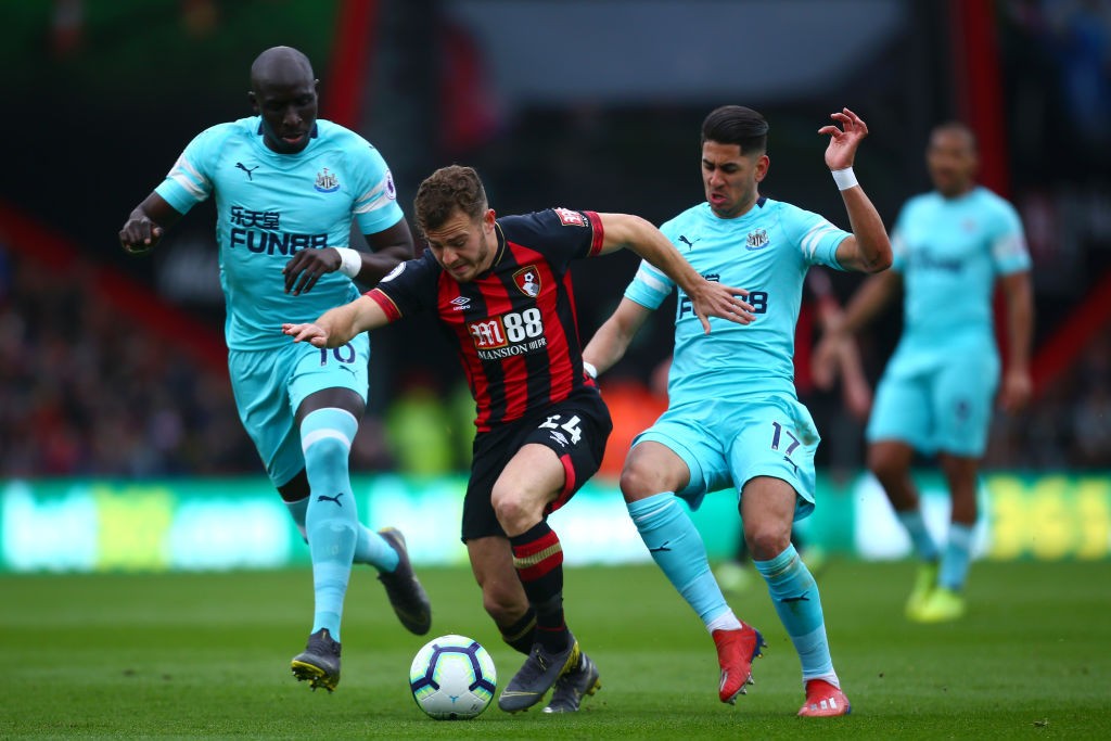 BOURNEMOUTH, ENGLAND - MARCH 16: Ryan Fraser of AFC Bournemouth is challenged by Ayoze Perez of Newcastle United and Mohamed Diame of Newcastle United during the Premier League match between AFC Bournemouth and Newcastle United at Vitality Stadium on March 16, 2019 in Bournemouth, United Kingdom. (Photo by Jordan Mansfield/Getty Images)