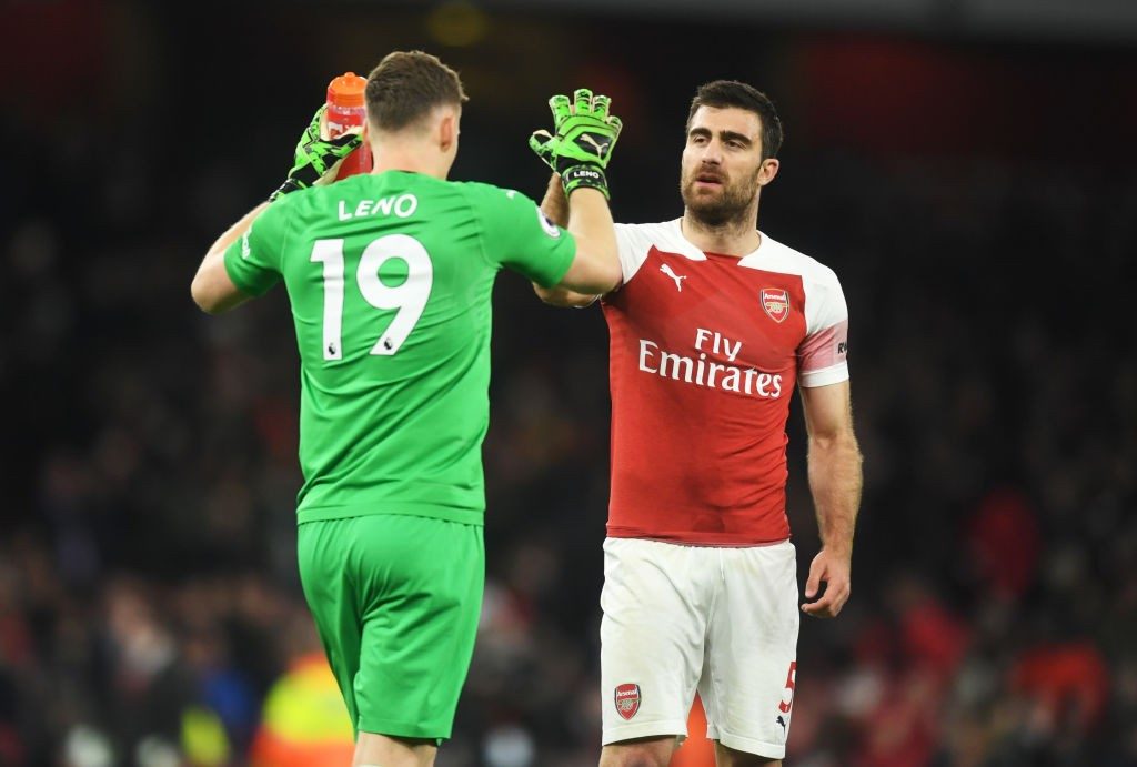 LONDON, ENGLAND - APRIL 01: Sokratis Papastathopoulos and Bernd Leno celebrate victory after the the Premier League match between Arsenal FC and Newcastle United at Emirates Stadium on April 01, 2019 in London, United Kingdom. (Photo by Michael Regan/Getty Images)
