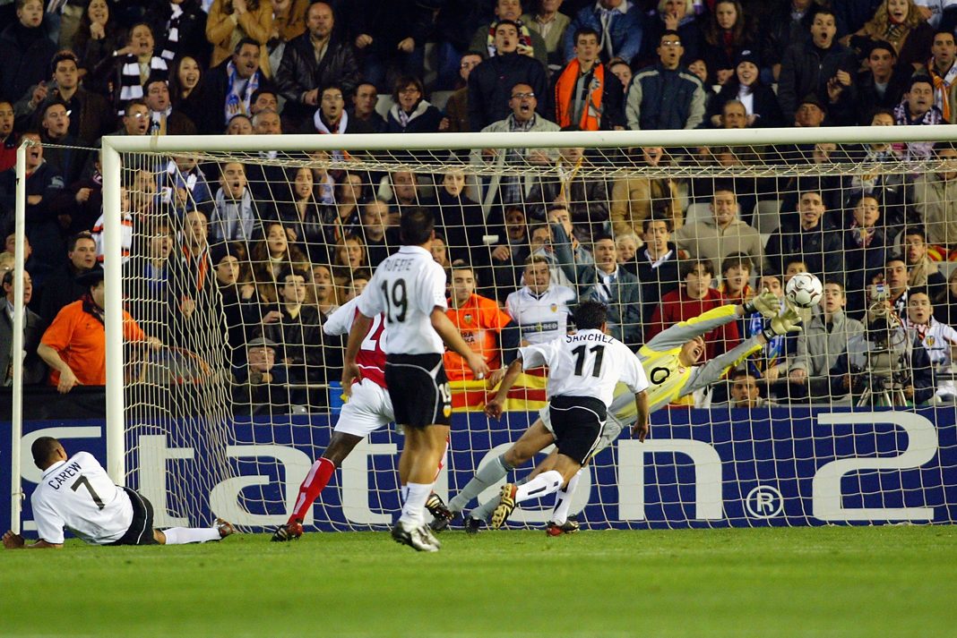 VALENCIA - MARCH 19: John Carew of Valencia scores the second and decisive goal during the UEFA Champions League Second Phase Group B match between Valencia and Arsenal held on March 19, 2003 at Mestalla Camp Del Valencia, in Valencia, Spain. Valencia won the match 2-1. (Photo by Ben Radford/Getty Images)