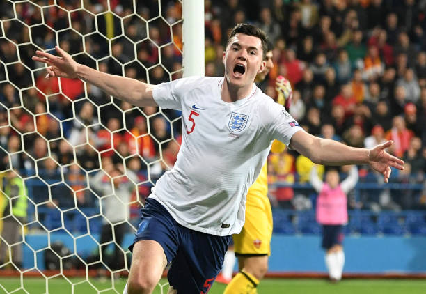 PODGORICA, MONTENEGRO - MARCH 25: Michael Keane of England (5) celebrates as he scores his team's first goal during the 2020 UEFA European Championships Group A qualifying match between Montenegro and England at Podgorica City Stadium on March 25, 2019 in Podgorica, Montenegro. (Photo by Michael Regan/Getty Images)
