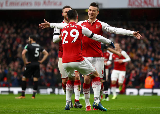 LONDON, ENGLAND - JANUARY 20: Laurent Koscielny of Arsenal celebrates scoring his side's third goalwith Granit Xhaka during the Premier League match between Arsenal and Crystal Palace at Emirates Stadium on January 20, 2018 in London, England. (Photo by Clive Mason/Getty Images)
