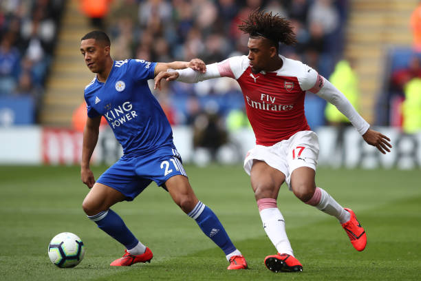 LEICESTER, ENGLAND - APRIL 28: Youri Tielemans of Leicester City in action with Alex Iwobi of Arsenal during the Premier League match between Leicester City and Arsenal FC at The King Power Stadium on April 28, 2019 in Leicester, United Kingdom. (Photo by Marc Atkins/Getty Images)