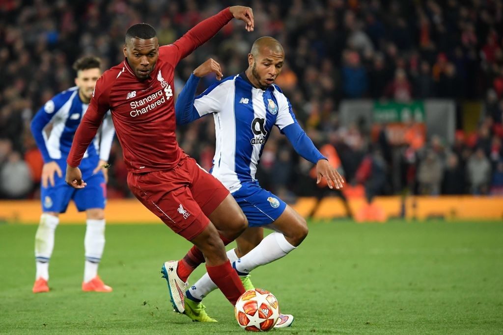 Liverpool's English striker Daniel Sturridge (L) vies for the ball with Porto's Algerian midfielder Yacine Brahimi (R) during the UEFA Champions League quarter-final, first leg football match between Liverpool and FC Porto at Anfield stadium in Liverpool, north-west England on April 9, 2019. (Photo by LLUIS GENE / AFP / Getty Images)