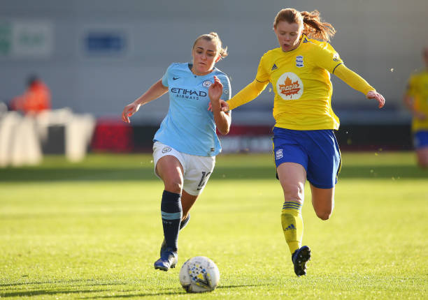 MANCHESTER, ENGLAND - DECEMBER 09: Georgia Stanway of Manchester City Women and Meaghan Sargeant of Birmingham City Women compete for the ball during the FA WSL match between Manchester City Women and Birmingham City Women at The Academy Stadium on December 9, 2018 in Manchester, England. (Photo by Alex Livesey/Getty Images)