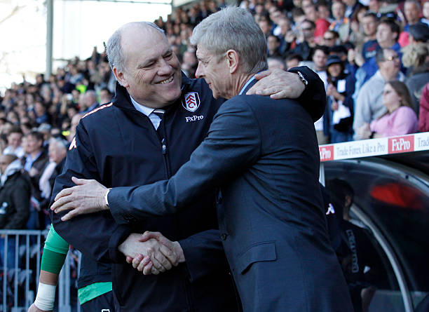Arsenal's French manager Arsene Wenger (R) and Fulham's Dutch manager Martin Jol (L) shake hands before kick off of the English Premier League football match between Fulham and Arsenal at Craven Cottage in London on April 20, 2013. Arsenal won 1-0. AFP PHOTO/IAN KINGTON